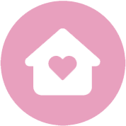 White house icon with a heart in the center, representing senior care, inside a pink circle on a light background.